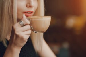 Lady taking a sip of coffee